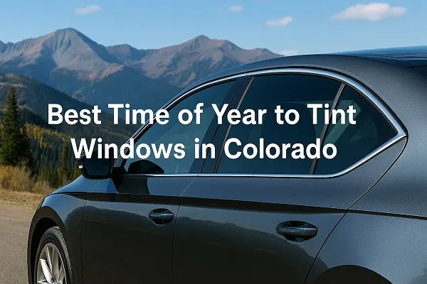 Tinted car windows with Colorado mountain backdrop and fall colors, representing the best time to tint windows in Colorado.