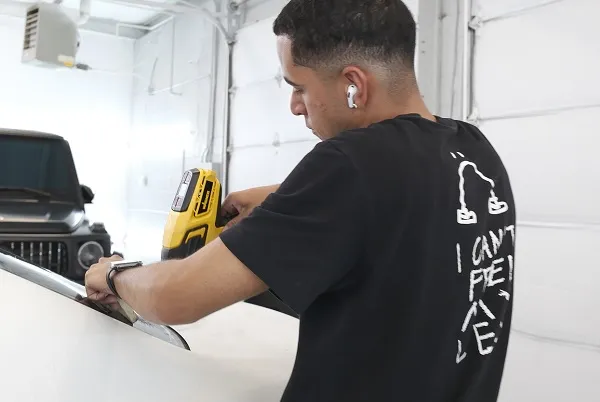 218 Customs applying Tint on customer car - 544126