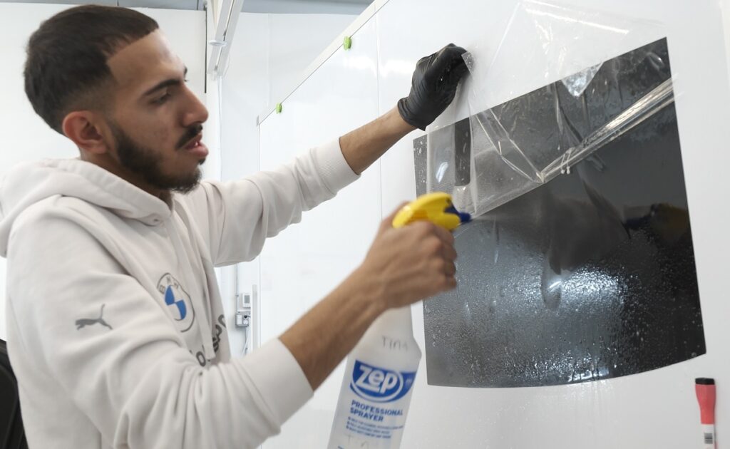 218 Customs applying Tint on customer car - 544127